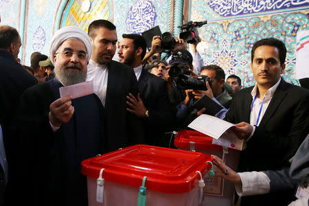 Iran's President Hassan Rouhani casts his ballot during the presidential election in Tehran, Iran, May 19, 2017. President.ir/Handout via REUTERS