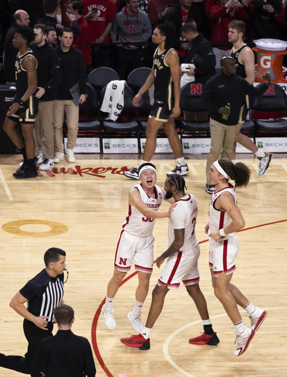 Nebraska's Keisei Tominaga, Brice Williams and Josiah Allick, from left, celebrate the team's 88-72 victory over Purdue in an NCAA college basketball game Tuesday, Jan. 9, 2024, in Lincoln, Neb. (AP Photo/Rebecca S. Gratz)