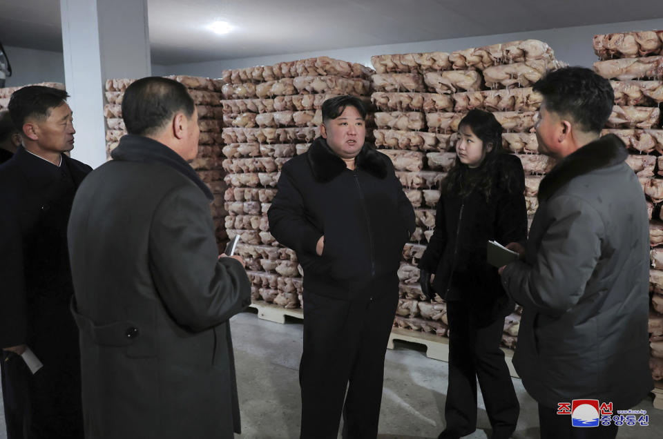 In this photo provided on Monday, Jan. 8, 2024, by the North Korean government, North Korean leader Kim Jong Un, center, with his daughter visits a newly-built poultry factory in Hwangju County of North Hwanghae Province on Jan. 7, 2024. Independent journalists were not given access to cover the event depicted in this image distributed by the North Korean government. The content of this image is as provided and cannot be independently verified. Korean language watermark on image as provided by source reads: "KCNA" which is the abbreviation for Korean Central News Agency. (Korean Central News Agency/Korea News Service via AP)