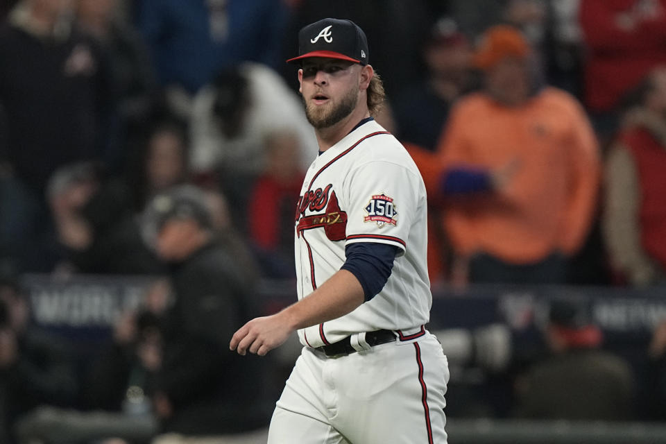 Atlanta Braves relief pitcher A.J. Minter leaves the game during the fifth inning in Game 5 of baseball's World Series between the Houston Astros and the Atlanta Braves Sunday, Oct. 31, 2021, in Atlanta. (AP Photo/Brynn Anderson)