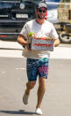 <p>Liam Hemsworth stocks up on food at a local grocery store in Byron Bay, Australia on Monday.</p>