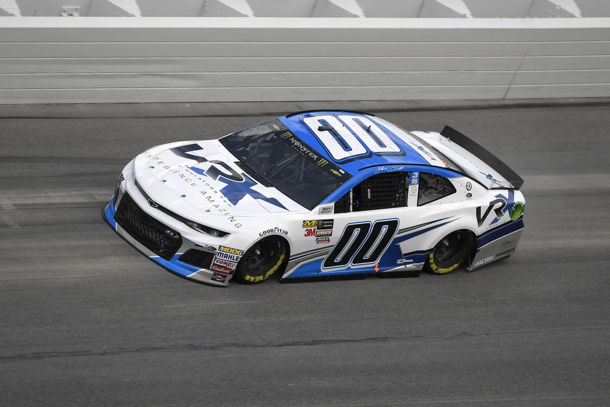 Jeffrey Earnhardt (00) makes his way through Turn 4 during qualifying for the Daytona 500 auto race at the Daytona International Speedway Sunday, Feb. 11, 2018, in Daytona Beach, Fla. (AP Photo/Phelan M. Ebenhack)