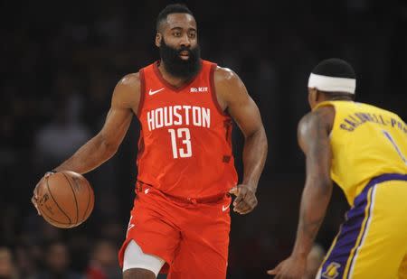 February 21, 2019; Los Angeles, CA, USA; Houston Rockets guard James Harden (13) moves the ball against Los Angeles Lakers guard Kentavious Caldwell-Pope (1) during the first half at Staples Center. Mandatory Credit: Gary A. Vasquez-USA TODAY Sports