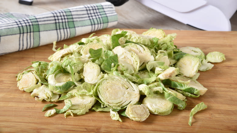 shredded brussels sprouts on a cutting board