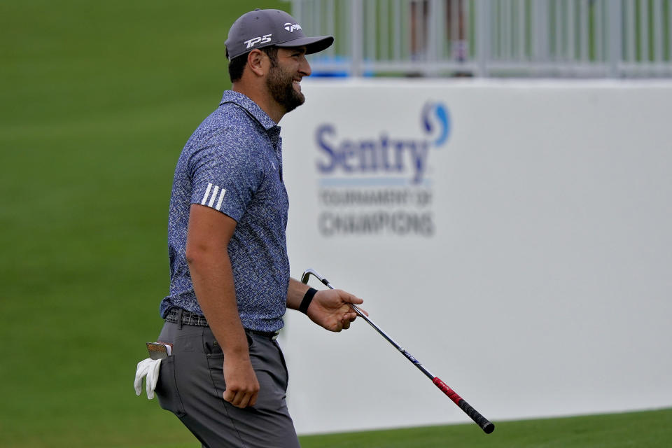 Jon Rahm smiles after chipping in for eagle on the ninth green during third round of the Tournament of Champions golf event, Saturday, Jan. 4, 2020, at Kapalua Plantation Course in Kapalua, Hawaii. (AP Photo/Matt York)