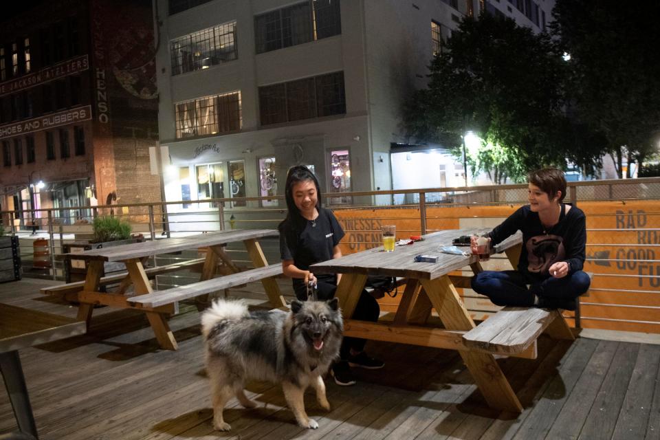 Sophie Tran and Alaynna McCormick with Leroy at Pour Taproom on Sunday, August 2, 2020.