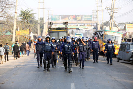 Police chase garments workers who have been protesting for higher wages, with water cannon at Ashulia, outskirt of Dhaka, Bangladesh, January 14, 2019. REUTERS/Mohammad Ponir Hossain