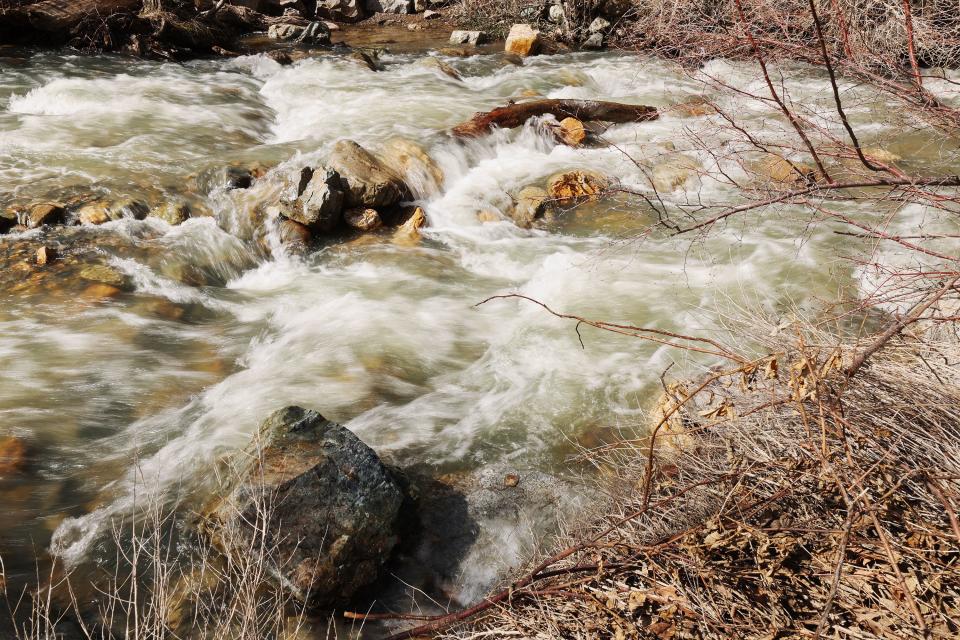 Water rushes down Big Cottonwood Creek in Big Cottonwood Canyon as outdoor recreation officials call for attention to safety at a press conference on Friday, April 14, 2023. The officials encouraged people to stay away from the spring runoff water and use extreme caution with kids and animals when around water. | Scott G Winterton, Deseret News