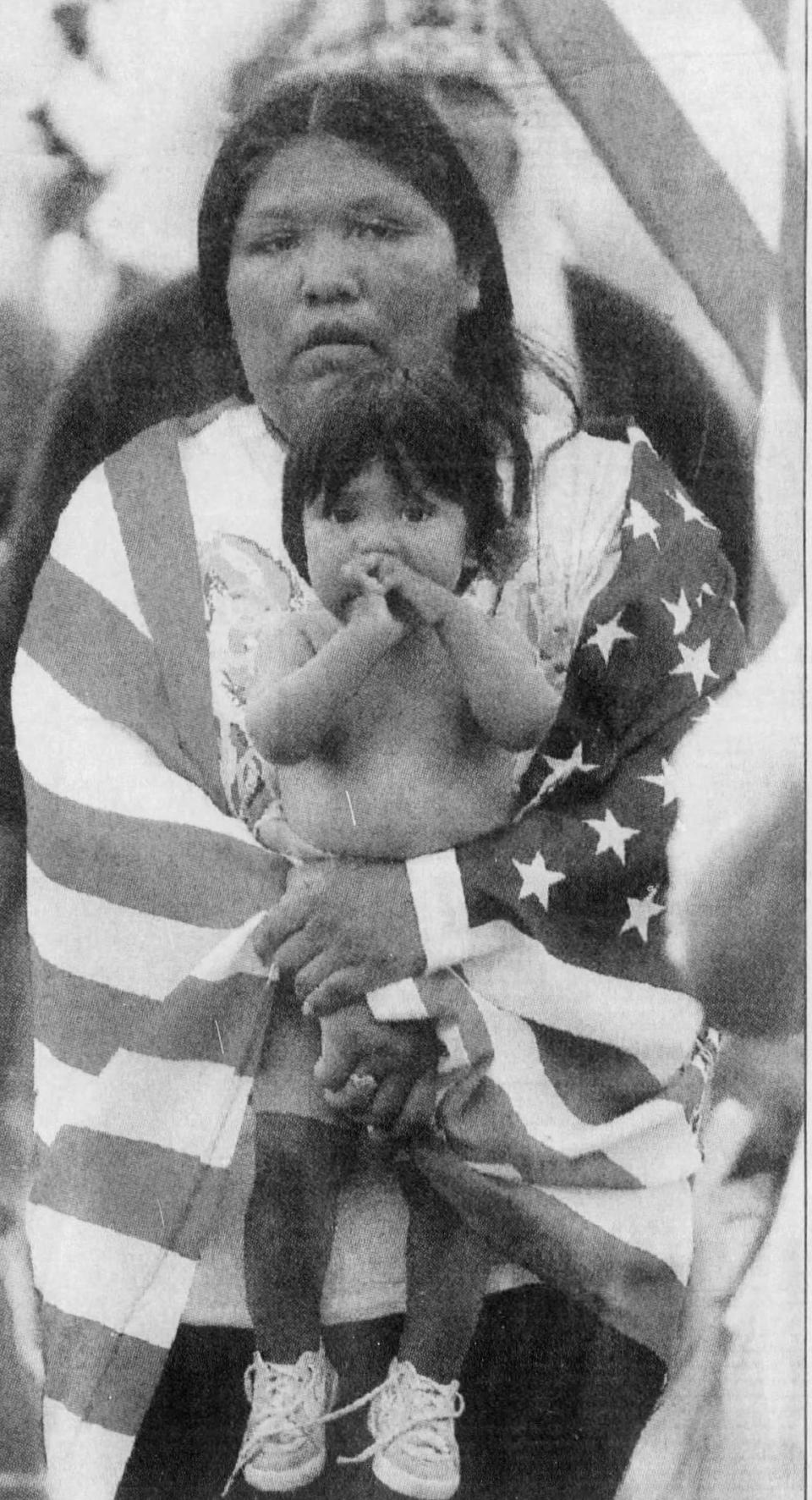 Wendy Thomas and her 11-month-old son, Spear, join protestors on a march from the Fort McDowell Indian Community gambling hall. The march, which began Tuesday and ends today at the state Capitol, is being made to protest the seizure of gambling machines. (Published May 20, 1992)