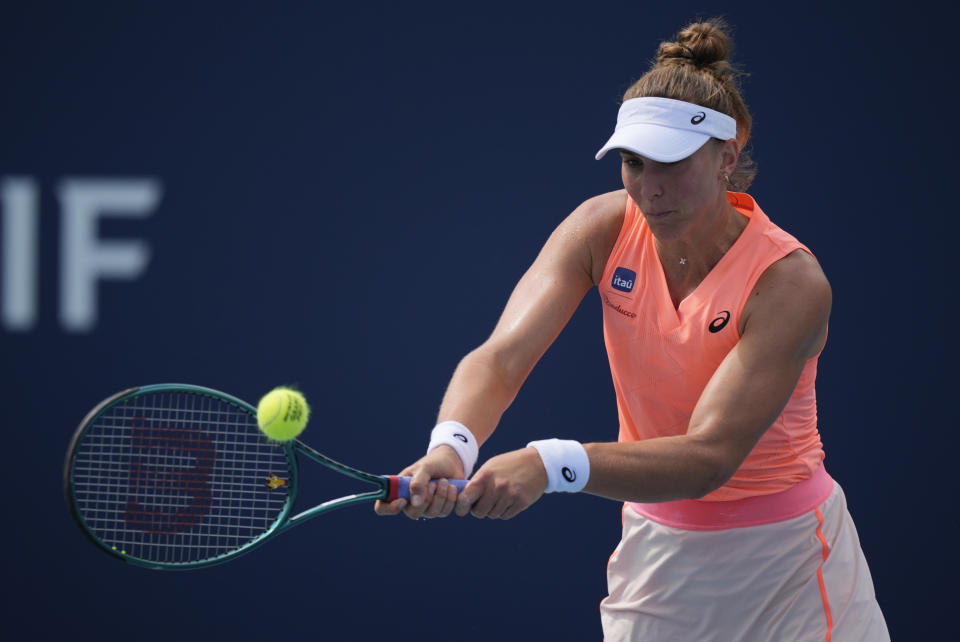 Beatriz Haddad Maia, of Brazil, plays a ball in her women's second round match against Diane Parry, of France, at the Miami Open tennis tournament, Thursday, March 21, 2024, in Miami Gardens, Fla. (AP Photo/Rebecca Blackwell)