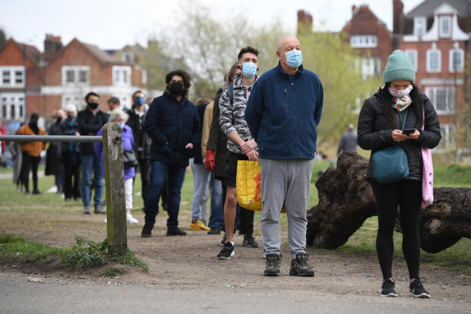 People stand in line for coronavirus surge testing on Clapham Common, south London. Thousands of residents have queued up to take coronavirus tests at additional facilities set up after new cases of the South African variant were found in two south London boroughs. 44 confirmed cases of the variant have been found in Lambeth and Wandsworth, with a further 30 probable cases identified. Picture date: Wednesday April 14, 2021. (Photo by Kirsty O'Connor/PA Images via Getty Images)