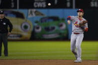 St. Louis Cardinals second baseman Nolan Gorman, right, throws to first base for an out against Oakland Athletics' Darell Hernaiz during the fifth inning of a baseball game Monday, April 15, 2024, in Oakland, Calif. (AP Photo/Godofredo A. Vásquez)