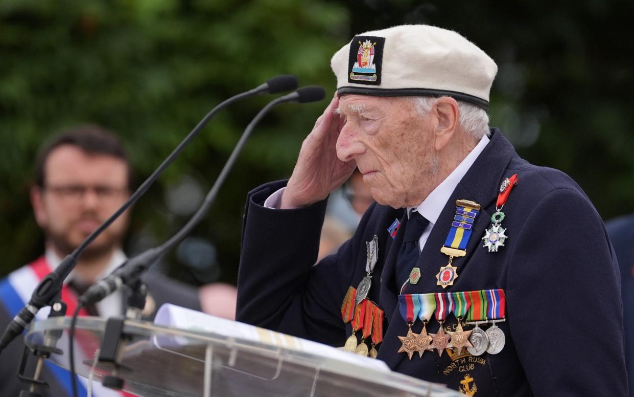 D-Day veteran Alec Penstone, 98, salutes as he speaks at the statue of Field Marshal Montgomery during the Spirit of Normandy Trust service in Coleville-Montgomery, France