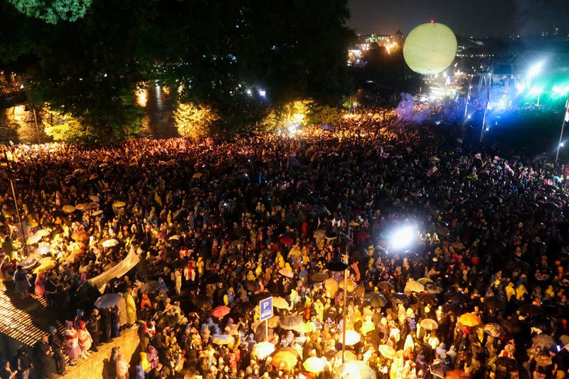 Demonstrators hold a rally to protest against a bill on "foreign agents" in Tbilisi