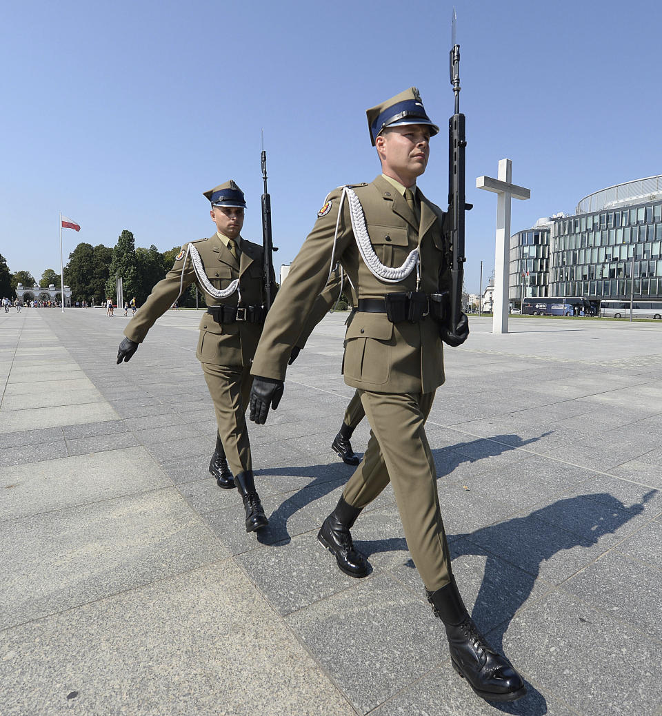 Polish soldiers take part in a changing of the guard at the Tomb of the Unknown Soldier at Pilsudski Square in Warsaw, Poland, Tuesday, Aug. 27, 2019. The square will be the site of commemorations Sunday marking the 80th anniversary of the start of World War II, to be attended by over 40 world leaders, including President Donald Trump.(AP Photo/Czarek Sokolowski)