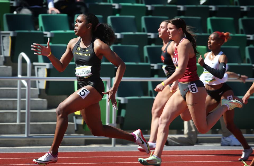 Oregon's Jasmine Montgomery, left, wins the Women 100 Meter Dash at the Hayward Premiere at Hayward Field Saturday April 2, 2022.