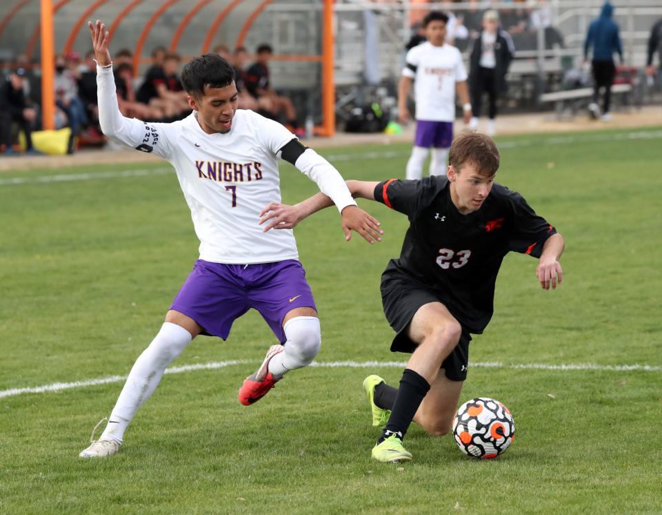 Northwest ClassenÕs Demsy Cifuentes and David Madrid fight for the ball as the Norman High School Tigers menÕs soccer team plays Northwest Classen high school at Gordon Drummond Field on April 1, 2022 in Norman, Okla.  [Steve Sisney/For The Oklahoman]