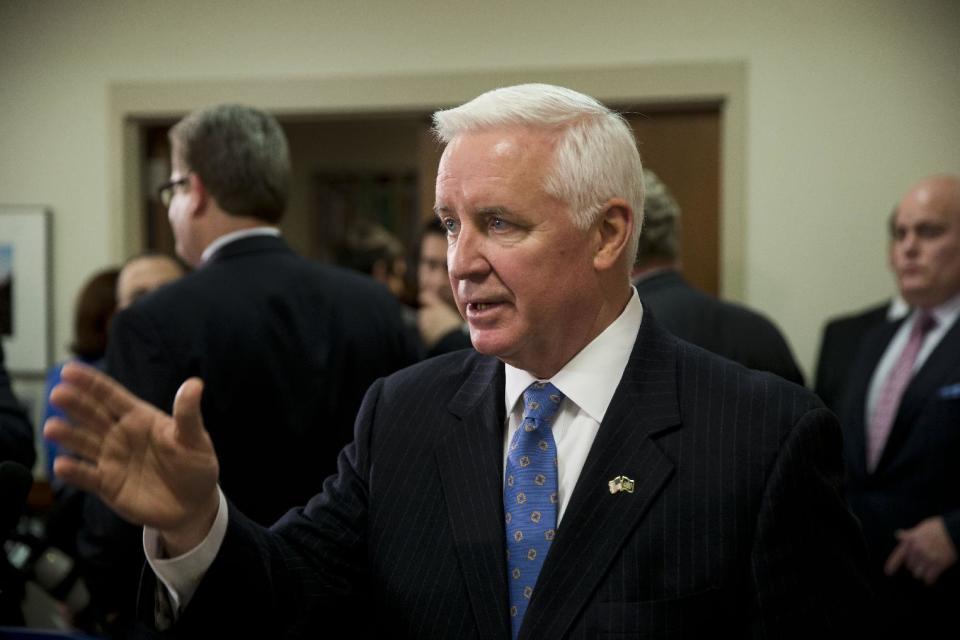 Gov. Tom Corbett gestures as he responds to a question during a news conference Friday, Jan. 17, 2014, in Philadelphia. Gov. A nearly 2-year-old requirement that almost all of Pennsylvania's 8.2 million voters must show photo identification before casting a ballot was struck down Friday by a state judge, setting the stage for a courtroom showdown before the state's highest court. The law, one of the strictest in the nation, was approved by the Republican-controlled Legislature and signed by Corbett in March 2012 over the protests of every single Democratic lawmaker. (AP Photo/Matt Rourke)