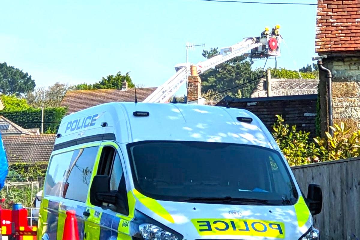 Fireflighters damping down the Brighstone property. <i>(Image: County Press)</i>