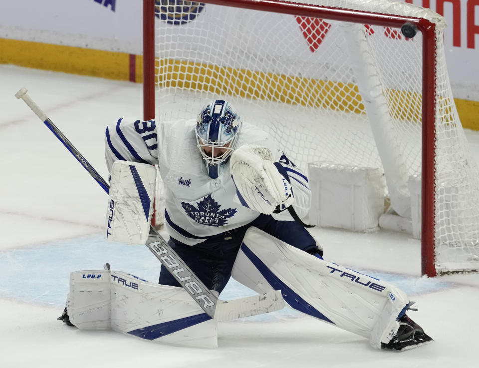 The puck hits the net behind Toronto Maple Leafs goaltender Matt Murray during overtime NHL hockey game action against the Ottawa Senators in Ottawa, Ontario, Saturday, March 18, 2023. (Adrian Wyld/The Canadian Press via AP)
