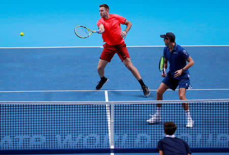 Tennis - ATP Finals - The O2, London, Britain - November 18, 2018 Mike Bryan and Jack Sock of the U.S. during their doubles match against France's Pierre-Hugues Herbert and Nicolas Mahut Action Images via Reuters/Andrew Couldridge