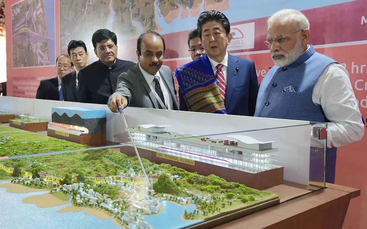Indian Prime Minister Narendra Modi and Japanese Prime Minister Shinzo Abe at a ceremony for the Mumbai-Ahmedabad high speed rail project - AFP