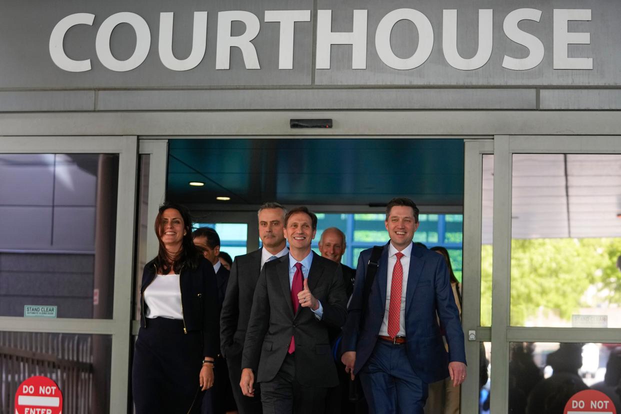 Dominion Voting Systems attorneys Davida Brook, left, Justin Nelson, centre, and Stephen Shackelford exit the Delaware Superior Court after Tuesday’s settlement. (Associated Press)