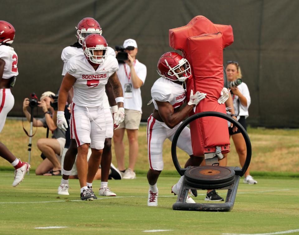 OU defensive back Justin Broiles (25) hits a sled during practice on Aug. 16 in Norman.