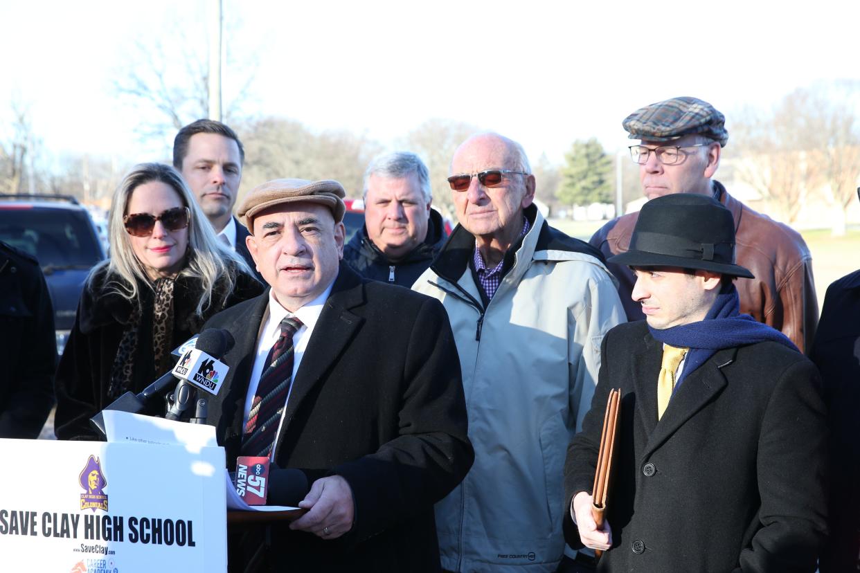 Attorney Peter Agostino speaks Wednesday, Dec. 13, 2023, in front of Clay High School about the announcement that Career Academy officials are seeking to lease-purchase Clay High School and make it a charter school.