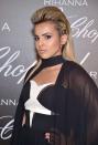 <p>We love Al Thani’s modern pompadour hairstyle with side braid accents, as the heightened hairstyle draws our attention to her winged eyeliner and highlighted cheekbones. (Photo: Getty Images) </p>