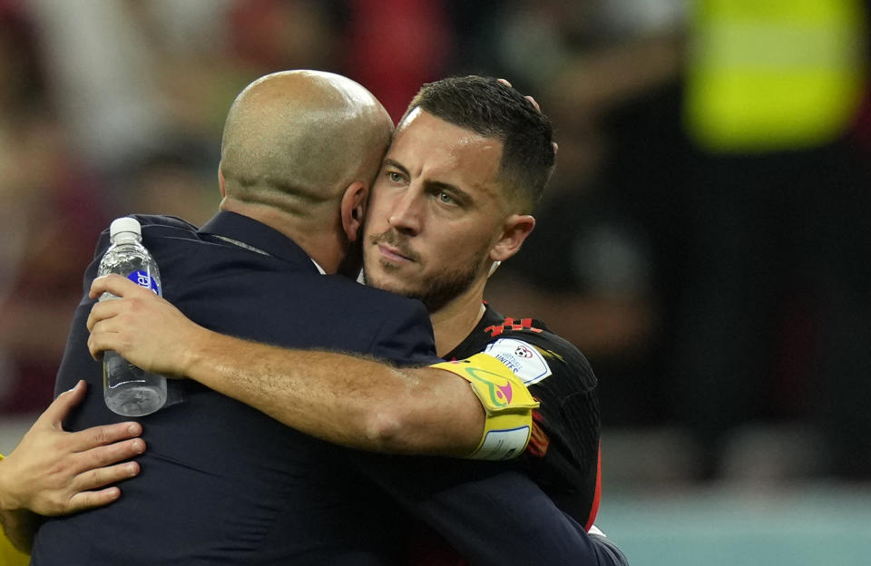 Belgium's head coach Roberto Martinez, left, hugs Belgium's Eden Hazard after the World Cup group F soccer match between Croatia and Belgium at the Ahmad Bin Ali Stadium in Al Rayyan, Qatar, Thursday, Dec. 1, 2022. (AP Photo/Francisco Seco)