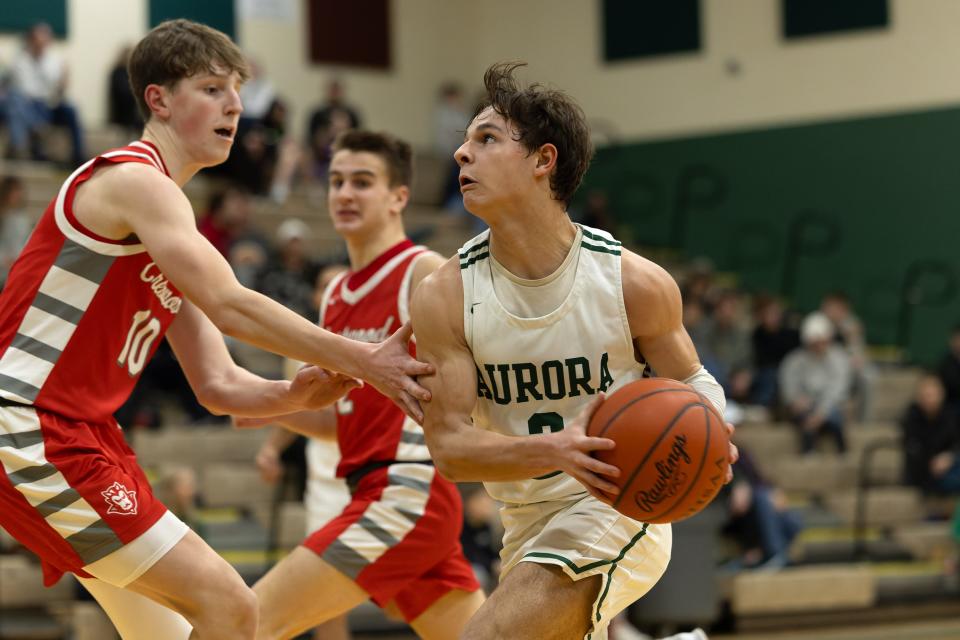 Aurora junior Zach Pannetti runs with the ball during Tuesday night’s basketball game against the Crestwood Red Devils at Aurora High School.