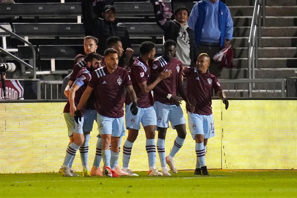 Colorado Rapids Dominique Badji (8) is congratulated by teammates after scoring a goal against the Seattle Sounders during the second half of an MLS soccer match Wednesday, Oct. 20, 2021, in Commerce City, Colo. (AP Photo/Jack Dempsey)