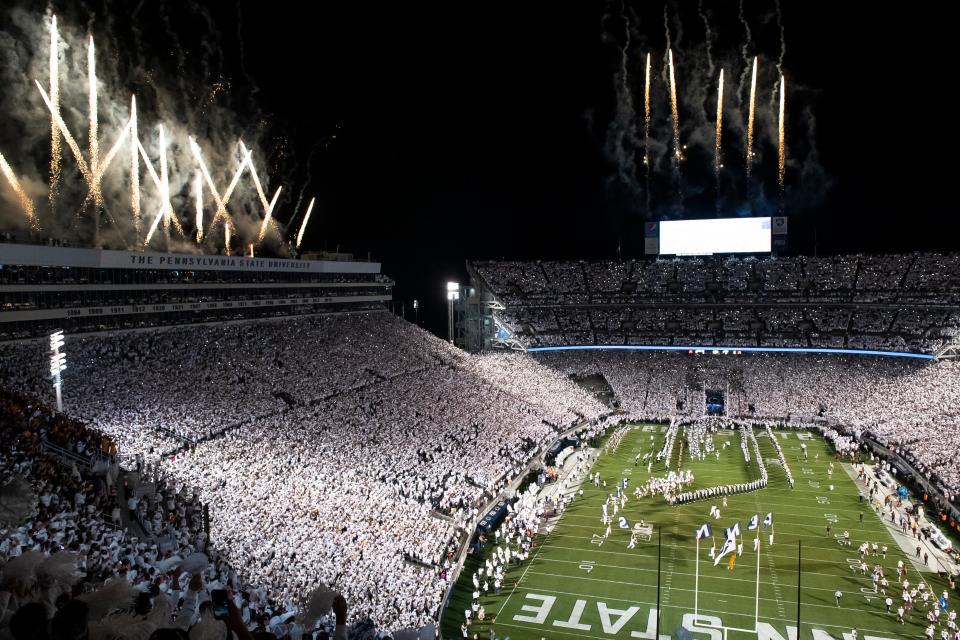 The Penn State Nittany Lions run onto the field to play Minnesota in a White Out game at Beaver Stadium on Saturday, Oct. 22, 2022, in State College. Penn State won, 45-17.