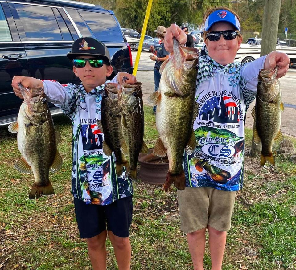 Jaxon Johnson, right, had big bass with a 6.38-pounder as he and partner Brayden Tyler reeled in 14.83 pounds to win the Junior Division of the Lakeland Junior Hawg Hunters tournament Nov. 13 on the Kissimmee Chain.