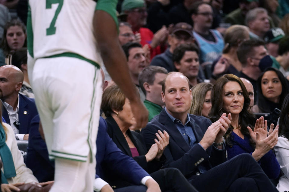 Britain's Prince William and Kate, Princess of Wales, applaud during an NBA basketball game between the Boston Celtics and the Miami Heat, Wednesday, Nov. 30, 2022, in Boston. (AP Photo/Charles Krupa)