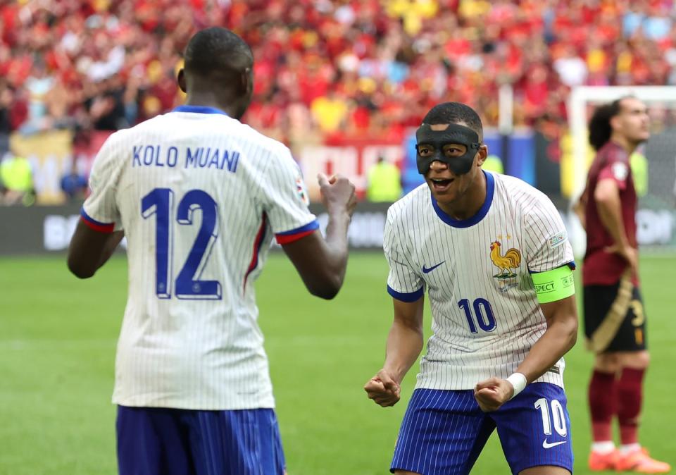 Kylian Mappe congratulates Randal Kolo Muani for earning France’s winner (Getty Images)