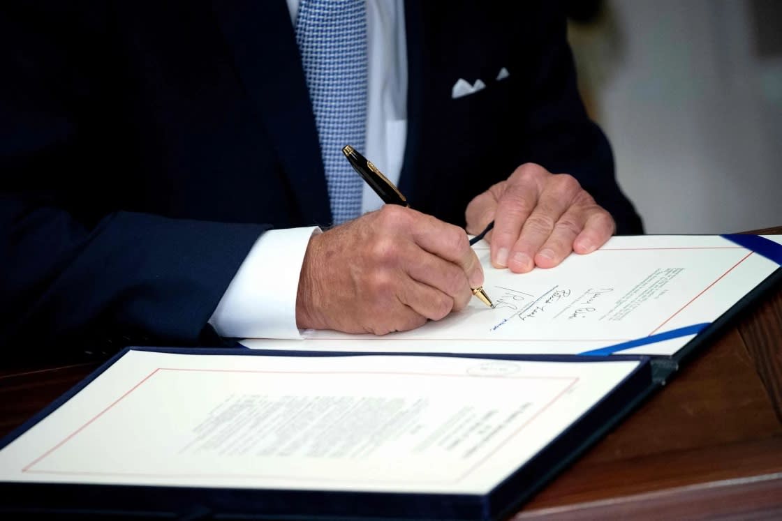 President Joe Biden signs the Bipartisan Safer Communities Act into law, in the Roosevelt Room of the White House in Washington, D.C. on June 25, 2022. (Stefani Reynolds / AFP via Getty Images)