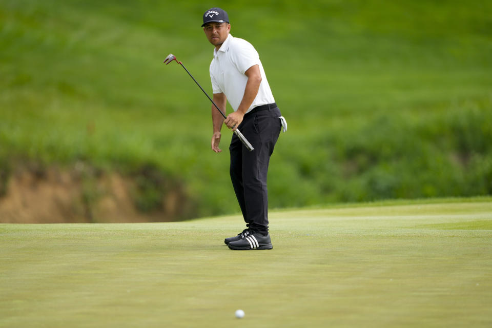 Xander Schauffele reacts after missing a putt on the third hole during the first round of the PGA Championship golf tournament at the Valhalla Golf Club, Thursday, May 16, 2024, in Louisville, Ky. (AP Photo/Matt York)