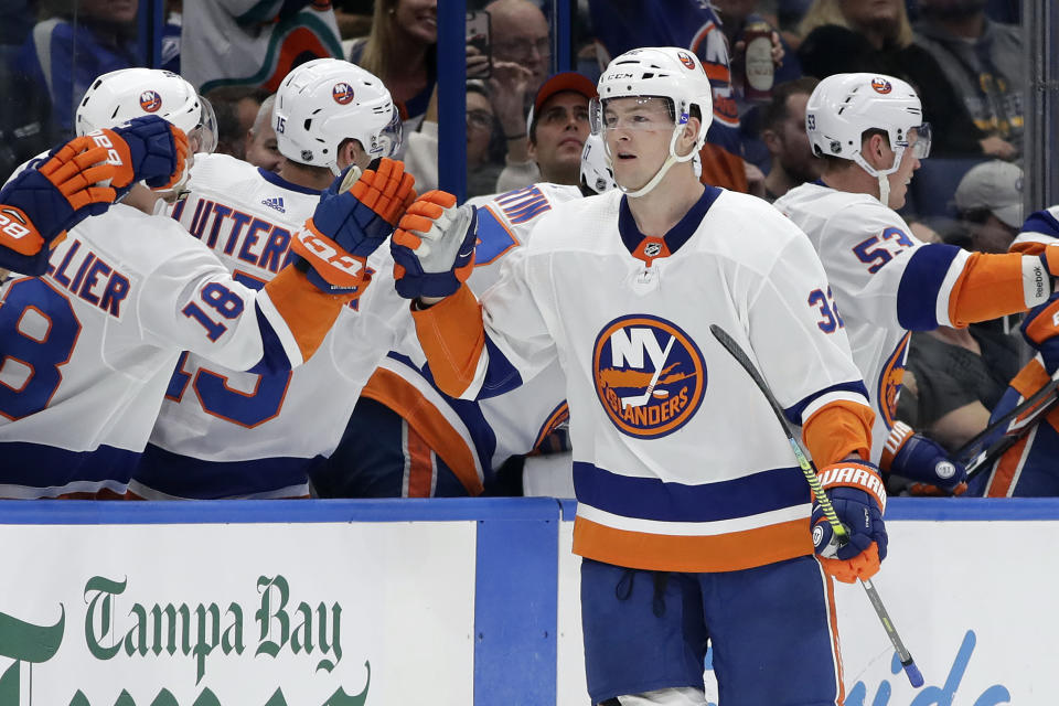 New York Islanders left wing Ross Johnston (32) celebrates with the bench after his goal against the Tampa Bay Lightning during the second period of an NHL hockey game Monday, Dec. 9, 2019, in Tampa, Fla. (AP Photo/Chris O'Meara)