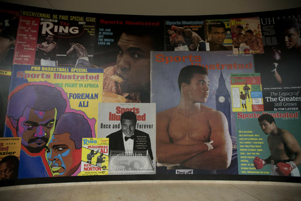 FILE - Large posters of mostly Sports Illustrated magazine covers are displayed at the "I Am The Greatest, Muhammad Ali" exhibition at the O2 arena, which hosts high profile boxing fights in London, June 4, 2016. Sports Illustrated will continue operations after the company that owns the brand reached an agreement with a new publisher for its print and digital products, Monday, March 18, 2024. (AP Photo/Matt Dunham, File)