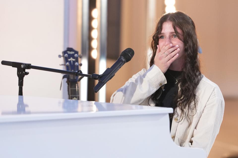 Abi Carter reacts to the judges' response to her rendition of Billie Eilish's "What Was I Made For?" during her audition.