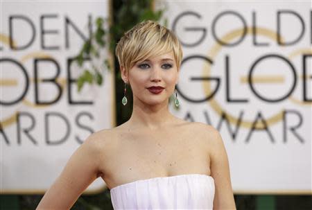 Actress Jennifer Lawrence, from the film "American Hustle," arrives at the 71st annual Golden Globe Awards in Beverly Hills, California January 12, 2014. REUTERS/Mario Anzuoni