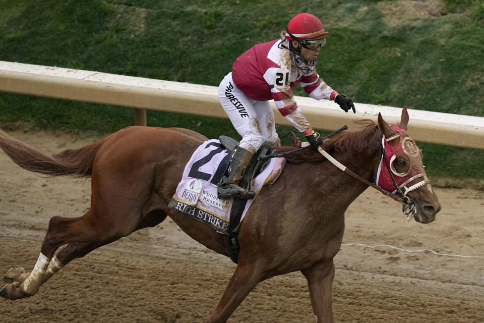 Sonny Leon celebrates after riding Rich Strike to victory in the 148th running of the Kentucky Derby horse race at Churchill Downs Saturday, May 7, 2022, in Louisville, Ky. (AP Photo/Charlie Riedel)