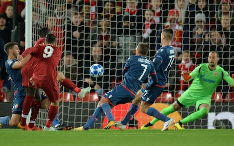 Liverpool's Roberto Firmino scores - Credit: Reuters