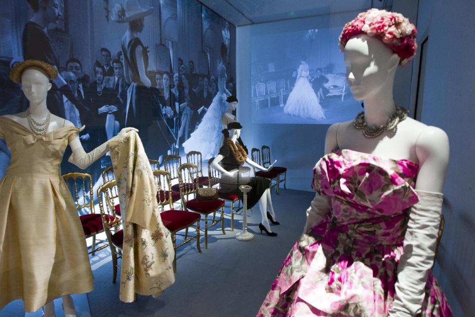 Mannequins in Christian Dior designs are seen at an exhibition at the childhood home of the designer in Granville, Normandy, France, Thursday, May 10, 2012. Going back to where it all began, a new exhibit in the childhood home of legendary designer Christian Dior in Normandy sheds new light on the house's huge contribution to the silver screen.The setting also provides rare insight into how a young Dior - a mama's boy who liked to spend time in the garden - became inspired by the Granville landscape and decided to dedicate his life to fashion. (AP Photo/Jacques Brinon)