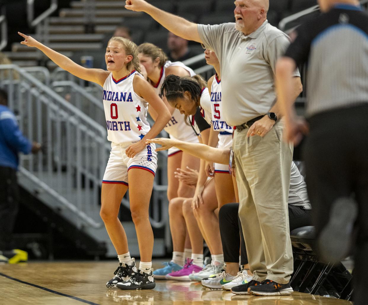 North Future All-Star Addie Bowsman (0), a sophomore from Twin Lakes High School, reacts to action on the court while on the bench during the first half of an girlsâ€™ Indiana High School Future All-Stars basketball game against Indiana South Future All-Stars, Saturday, June 10, 2023, at Gainbridge Fieldhouse, in Indianapolis.