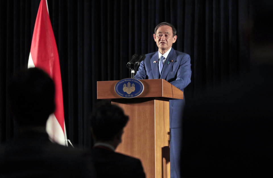 Japanese Prime Minister Yoshihide Suga speaks to the media during a press conference in Jakarta, Indonesia, Wednesday, Oct. 21, 2020. Suga is on a four-day visit to Vietnam and Indonesia. (AP Photo/Dita Alangkara, Pool)