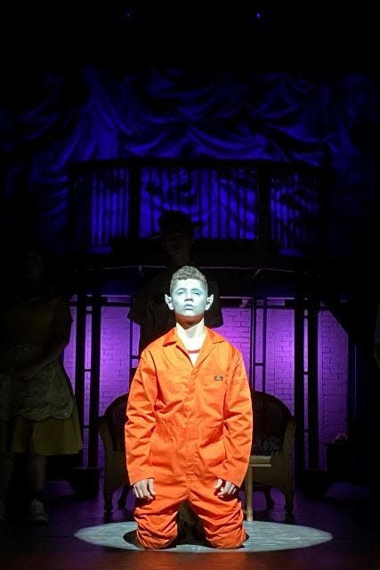 Liam Ginsburg as the Bat Boy, Edgar, wonders if he will ever be accepted by the townspeople in Pelham Memorial High School's production of “Bat Boy: The Musical."