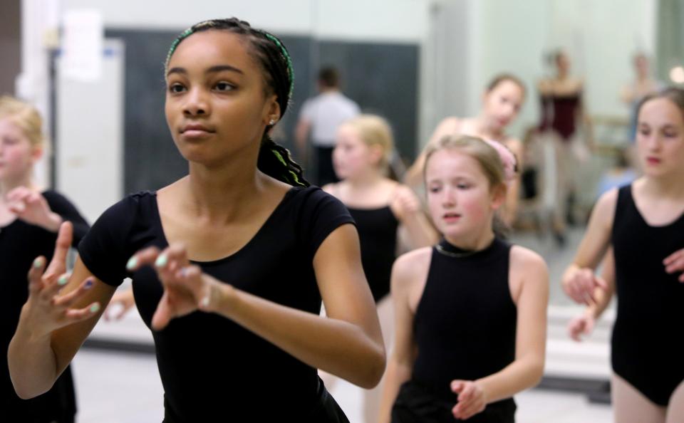 Sarai Hill, left, joins other dancers to rehearse the battle scene Wednesday, Nov. 30, 2022, at Colfax Cultural Center for Southold Dance Company’s annual production of "The Nutcracker."